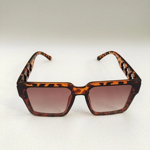 Detailed top view of vintage oversized tortoiseshell sunglasses with cutout temple design