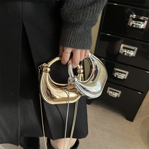 Mini crescent acrylic evening bag in gold and silver with metallic chain strap