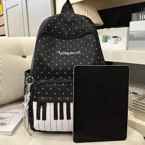 Polka dot backpack with piano key design and music embroidery for school students