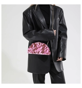 Pink metallic crossbody half-moon clutch with ruched pleats and gold chain strap detail