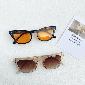 Vintage cat eye sunglasses in black with orange lenses and champagne with tea gradient lenses
