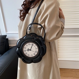Vintage clock handbag for women featuring a black flower shape and PU leather straps