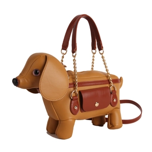 Creative dachshund-shaped crossbody bag in yellow and maroon faux leather with chain