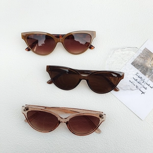 Chic cat eye sunglasses set in dark coffee, tortoise, and tea colors with gradient lenses