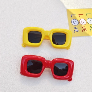 Retro chunky square sunglasses in bright yellow and red with UV protection and black lenses