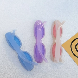 Candy colored cat eye sunglasses in light blue, lilac and pink with thick acrylic frames
