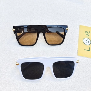 Classic large square sunglasses in black and white frames with retro metal accents