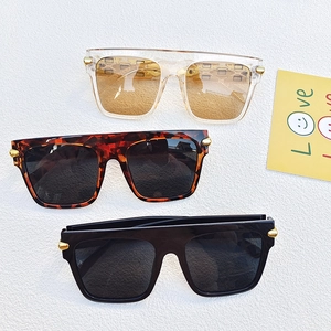 Classic oversized square sunglasses in black, tortoiseshell and tea colors with rivets