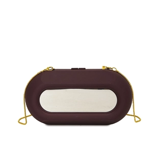 Irregular acrylic chain bag in burgundy red with silver mirror decor and gold chain strap