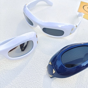 Retro oversized wrap sunglasses with gold triangle details and UV protective lenses