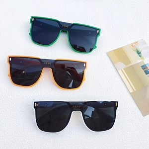 Flat top oversized sunglasses set in green, orange, and white with dark lenses