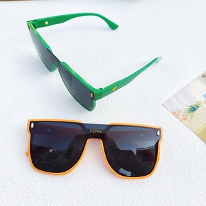 Oversized trendy shield sunglasses in bright green and orange with flat top frame