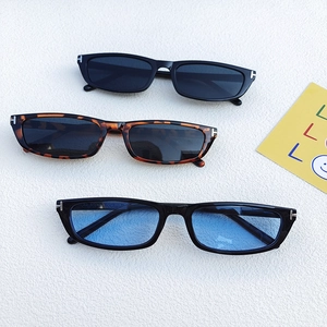 Flat lay of rectangular sunglasses with metal T-hinge detail in multiple frame colors
