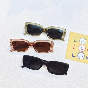 Retro rectangular sunglasses in olive green, amber brown, and classic black frames