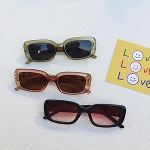 Vintage narrow rectangular sunglasses in green, brown and black with Y2K star details