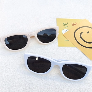 Stylish 2024 women's anti-UV sunglasses in white and beige frames with dark lenses