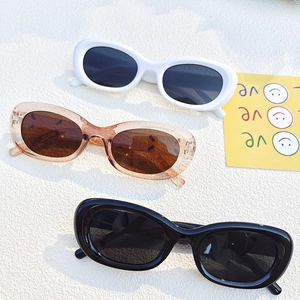 Retro oval cat-eye sunglasses in black, white, and tea colors with vintage frames