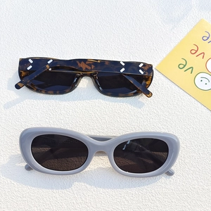 Detail view of tortoiseshell and grey sunglasses with JH18175 model code engraving