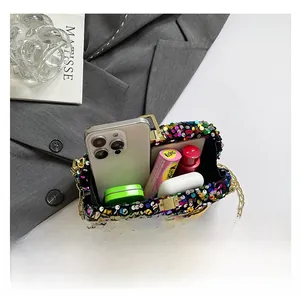 Detail showing the compact interior capacity of the sequin evening clutch bag