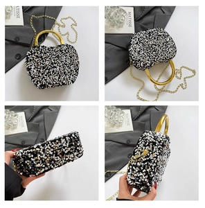 Detail view of sequin handbag with gold metal handle and crossbody chain strap