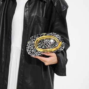 Sparkly sequin evening clutch bag with modern gold metal handle and chain strap