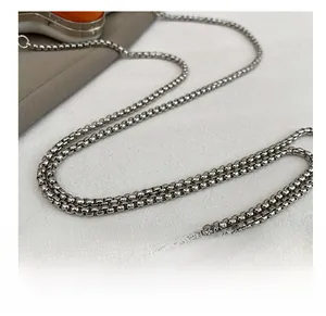 Macro shot of durable silver box chain strap with polished stainless steel finish