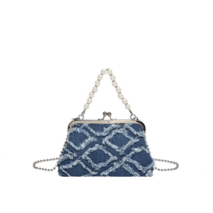Vintage denim shell bag with frayed diamond pattern and elegant pearl handle