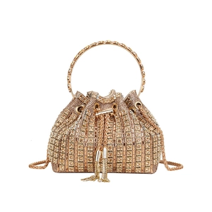 Elegant gold rhinestone bucket evening bag with tassels and round metal handle for women