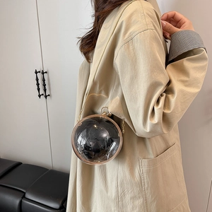 Chic acrylic spherical evening bag with transparent shell and gold chain strap