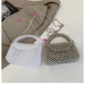 Detail of beaded acrylic handbags showing silver metal beads and transparent bead textures