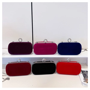 Detailed view of luxury velvet evening clutch bags in six colors with rhinestone ring clasps