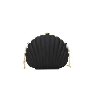 Elegant black shell-shaped acrylic evening clutch with gold chain strap and metal clasp