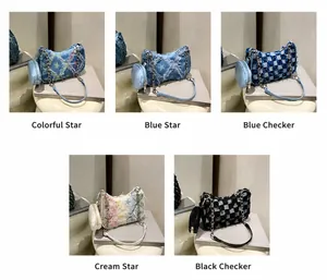Macro shot of gradient denim star crossbody bag with fringe edges and metal chain strap