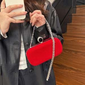 Red velvet evening clutch bag with crystal ring clasp and silver chain strap
