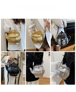 Detailed views of creative teapot crossbody bag in metallic gold and silver textured finish