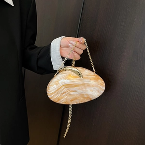 Acrylic marble clutch bag with gold crescent lock and chain strap for evening wear