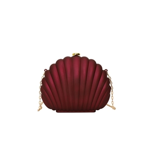Elegant deep red shell-shaped evening clutch bag with gold chain strap and metal clasp