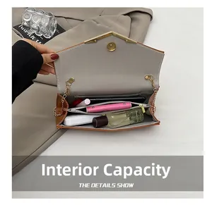Detail view of the brown leather envelope bag interior with multiple compartments