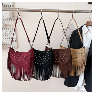 Detailed view of suede fringe crossbody bags in burgundy, black, brown and khaki