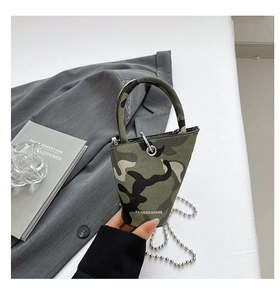 Detail of a camo mini bucket bag with a round handle and stylish silver ball chain strap