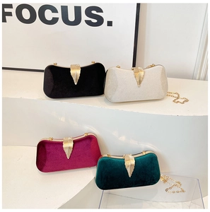 Velvet evening clutches with gold leaf clasps in black, cream, burgundy, and green
