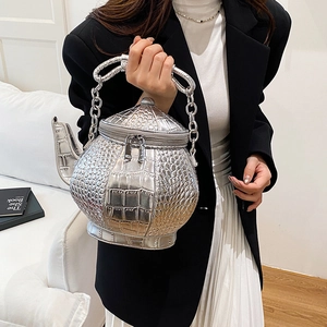 Unique 3D teapot-shaped crossbody bag in silver crocodile texture with metal chain