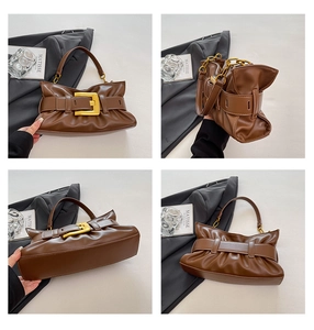 Detail view of a brown pleated handbag with a large gold buckle from multiple angles
