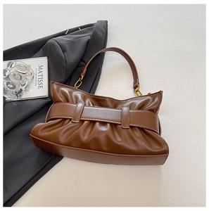 Detailed close-up of dark brown pleated cloud bag featuring golden metal chain link straps