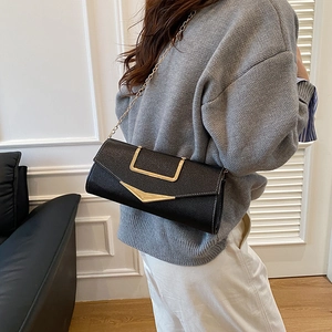 Chic black litchi pattern leather crossbody bag with gold chain and U-shaped handle