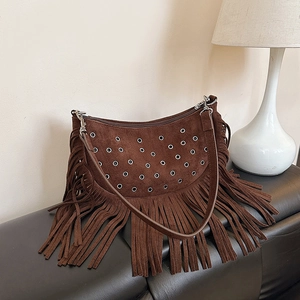 Vintage brown suede fringe crossbody bag with metallic eyelets and woven details