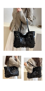 Dettaglio della borsa tote con paillettes nere con texture luccicante e rivetti d'oro