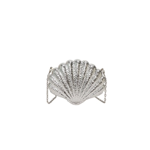Close-up of a silver shell-shaped evening clutch bag with metallic texture and chain strap