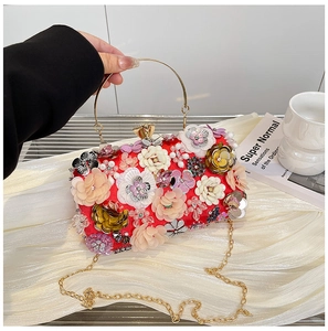 Detail of red floral evening bag with 3D fabric flowers, sequins and gold ring handle
