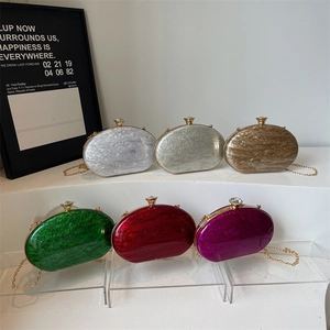Chic oval acrylic clutch bags with marble texture and chain straps in multiple colors